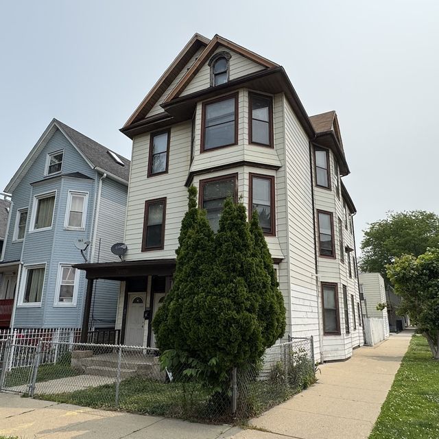 3801 N. Albany Ave.: As bought · side